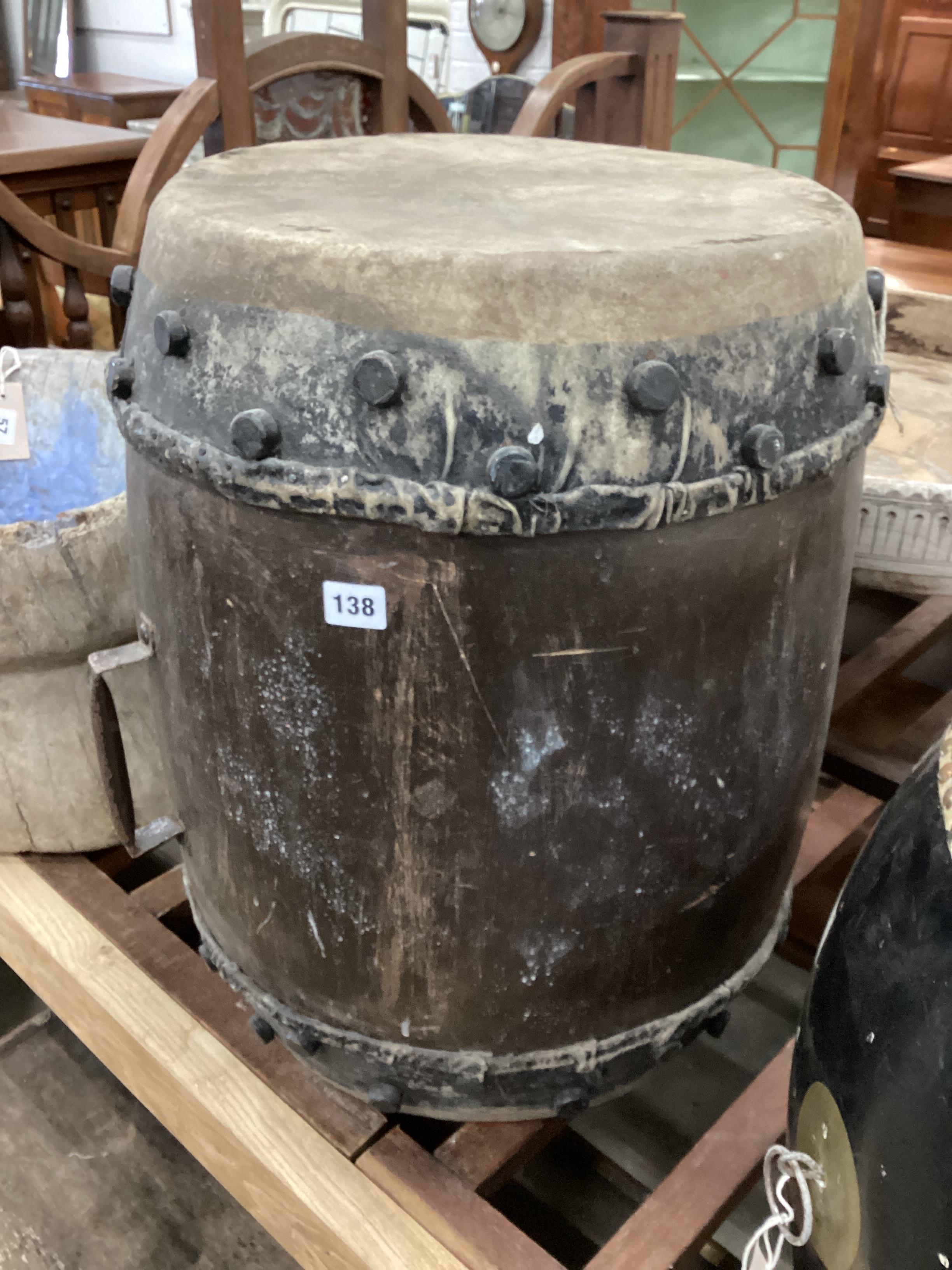 An African hide and hardwood drum, height 59cm